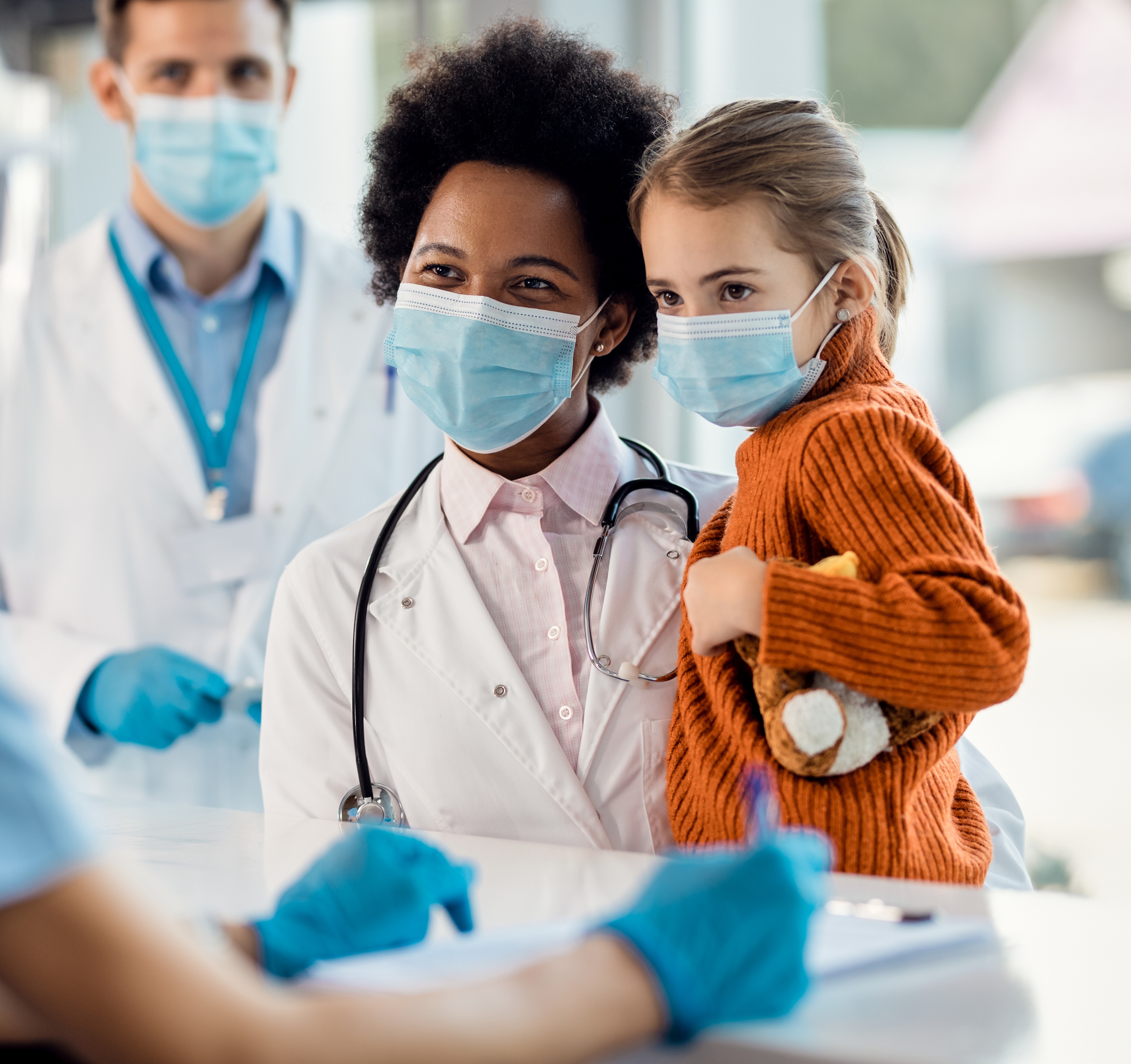 Doctors holding kid