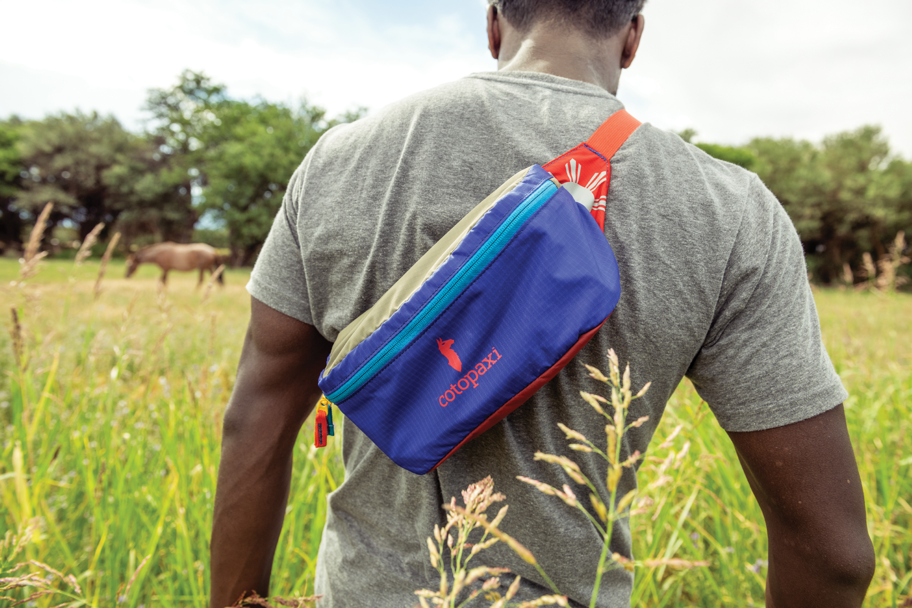 man wearing cotopaxi sling bag