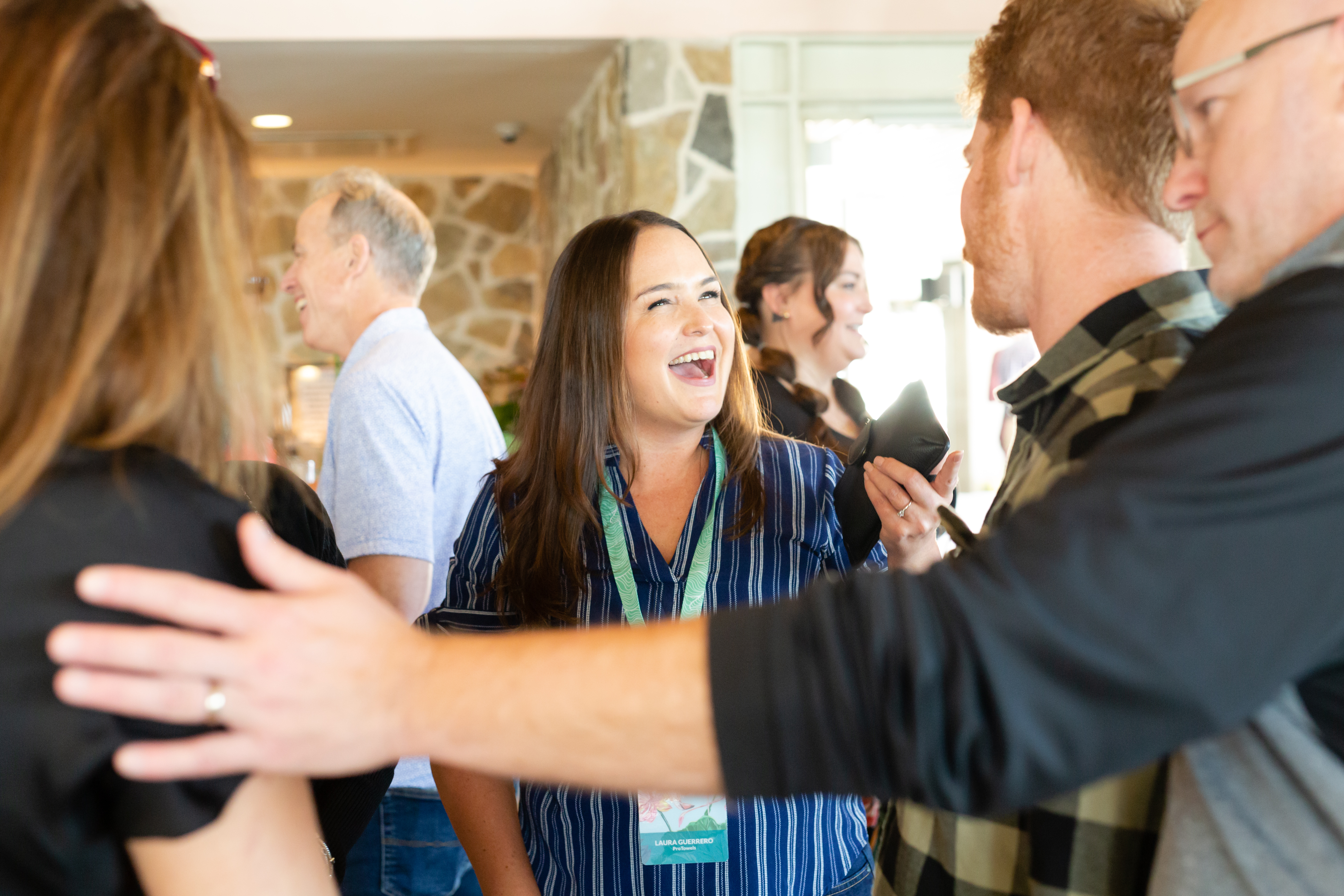 laughing woman in group at event