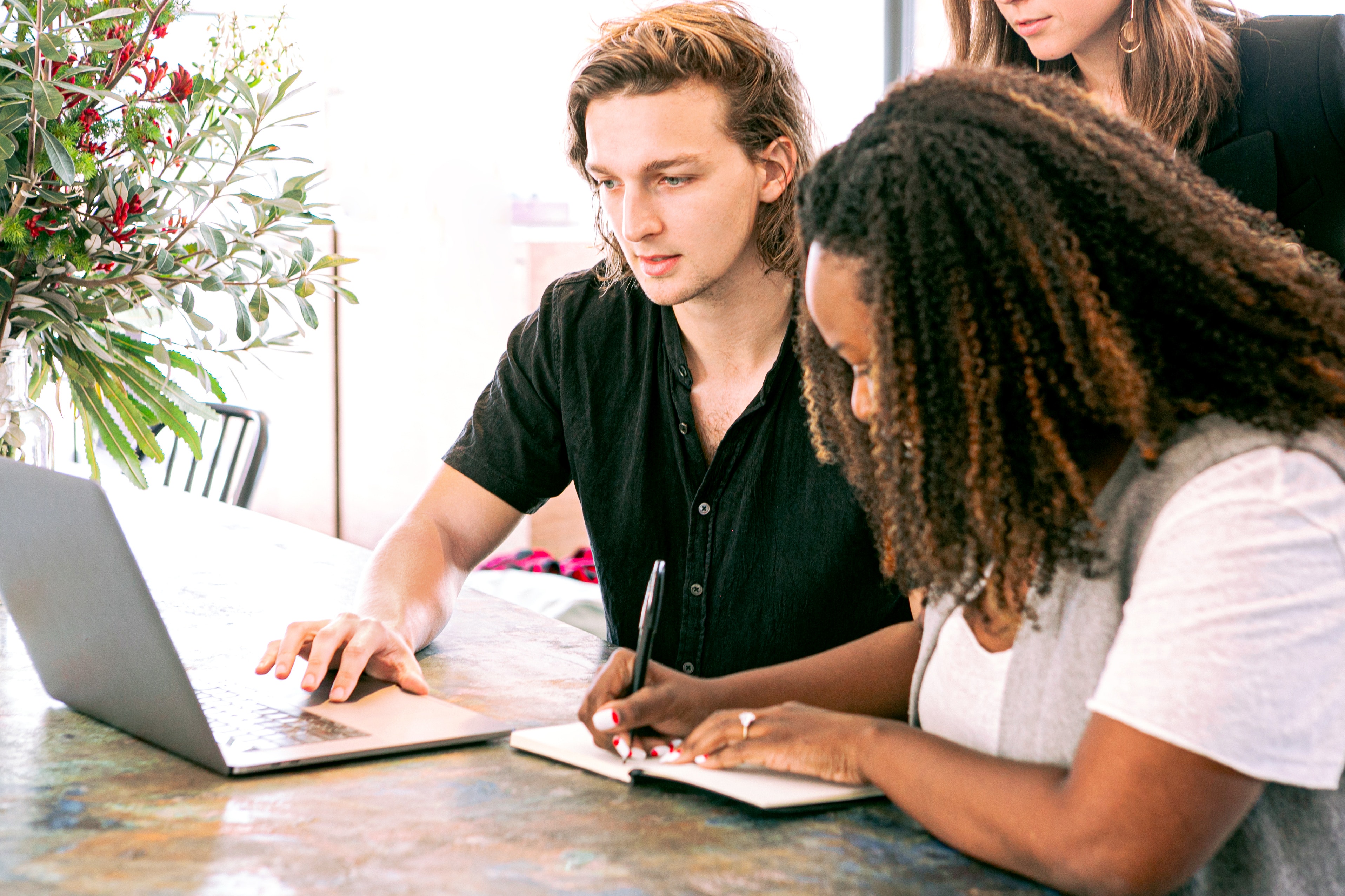 group of marketers around a computer