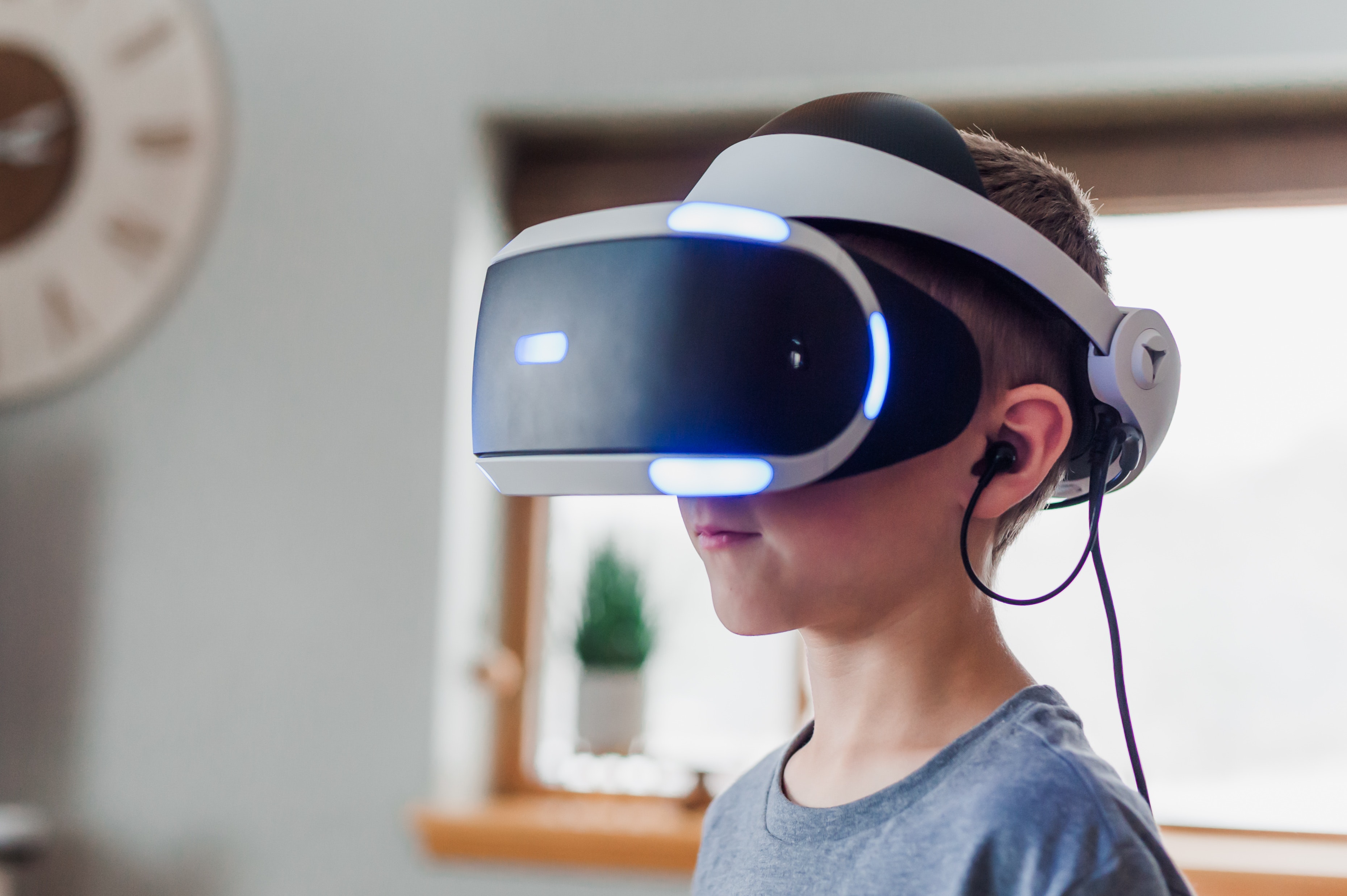 little boy wearing VR headset