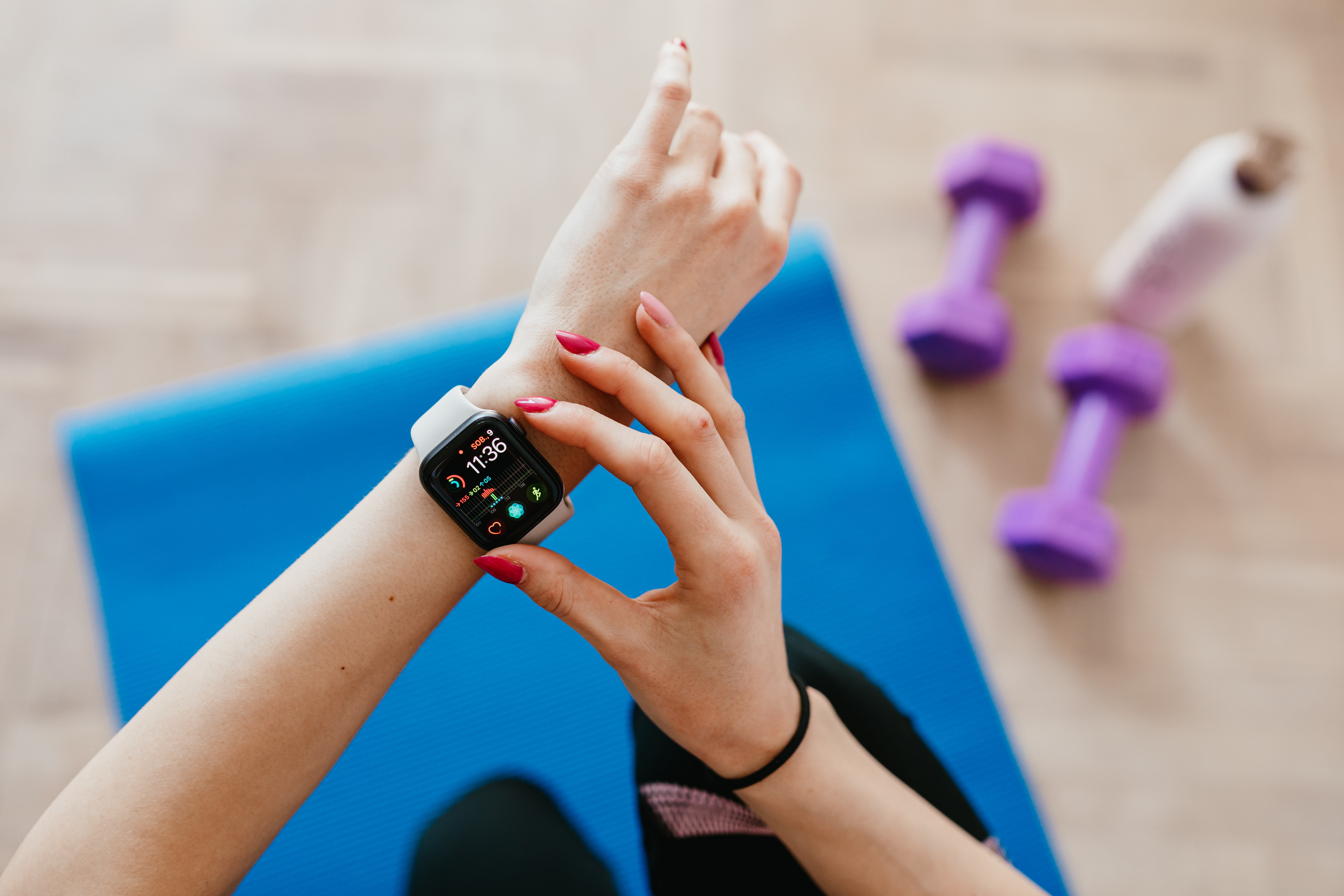 checking smart watch during workout
