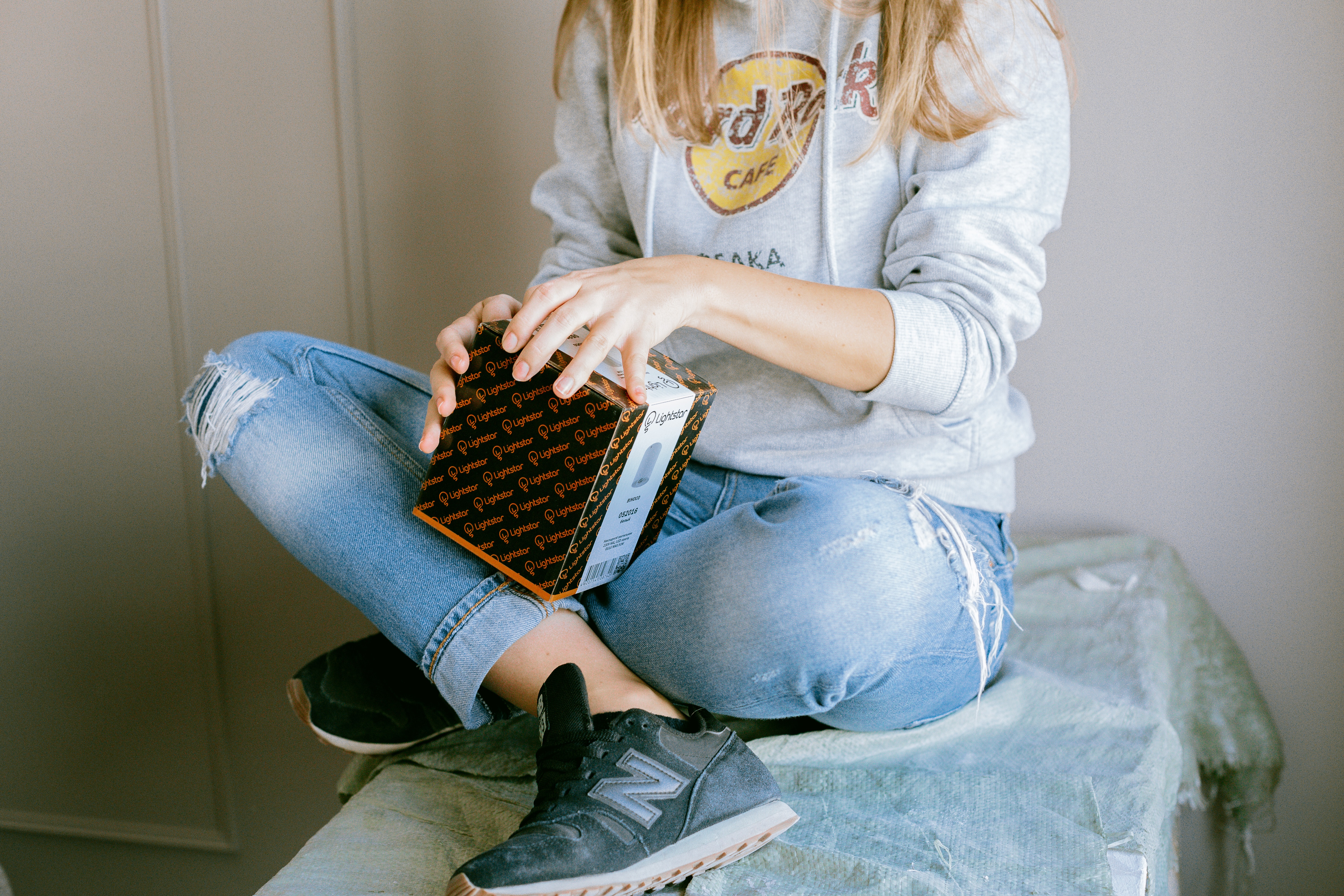 girl holding a branded box